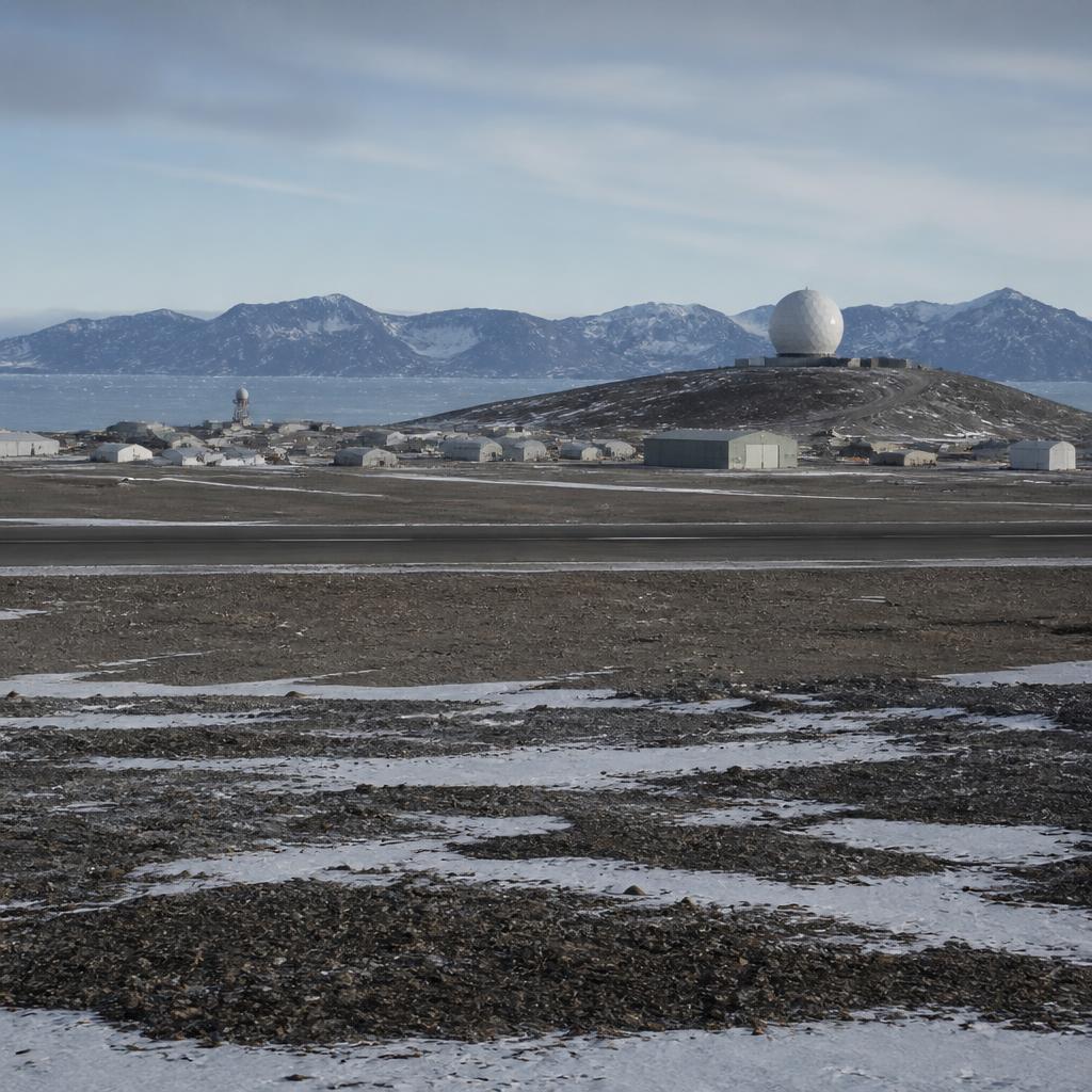 Snow-covered crashed bomber debris on the Arctic ice near Thule Air Base, Greenland.